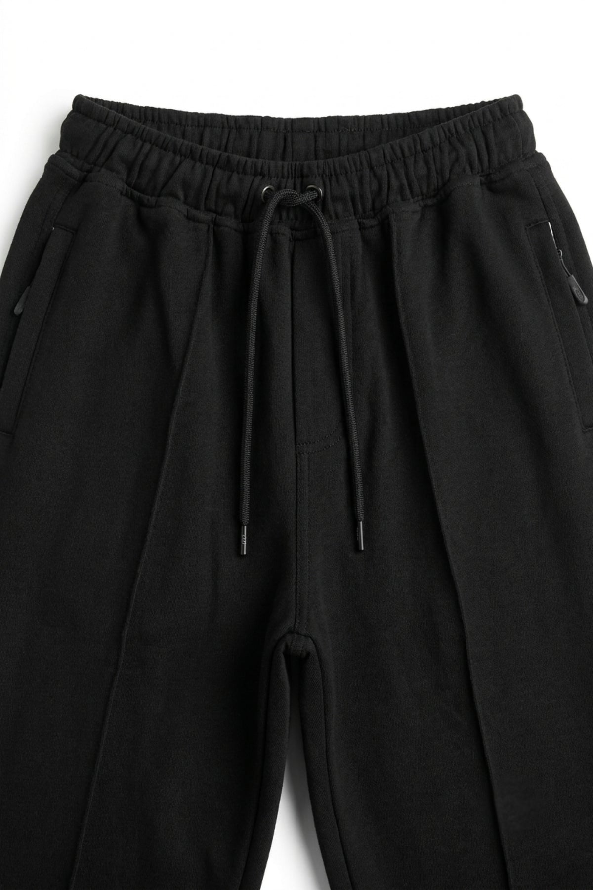 Close-up of the elasticated waistband and adjustable drawstrings on the Deep Black lightweight terry trousers.