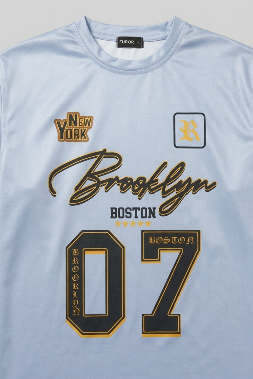 Close-up of Athletic Interlock fabric and high-definition Brooklyn Boston print on Carolina Blue jersey.