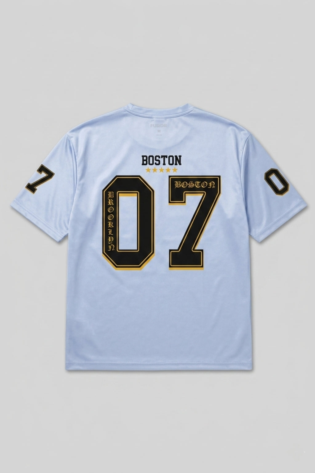 Full back flat lay of The Coastal Hybrid Jersey in Carolina Blue showing boxy silhouette and athletic graphics.