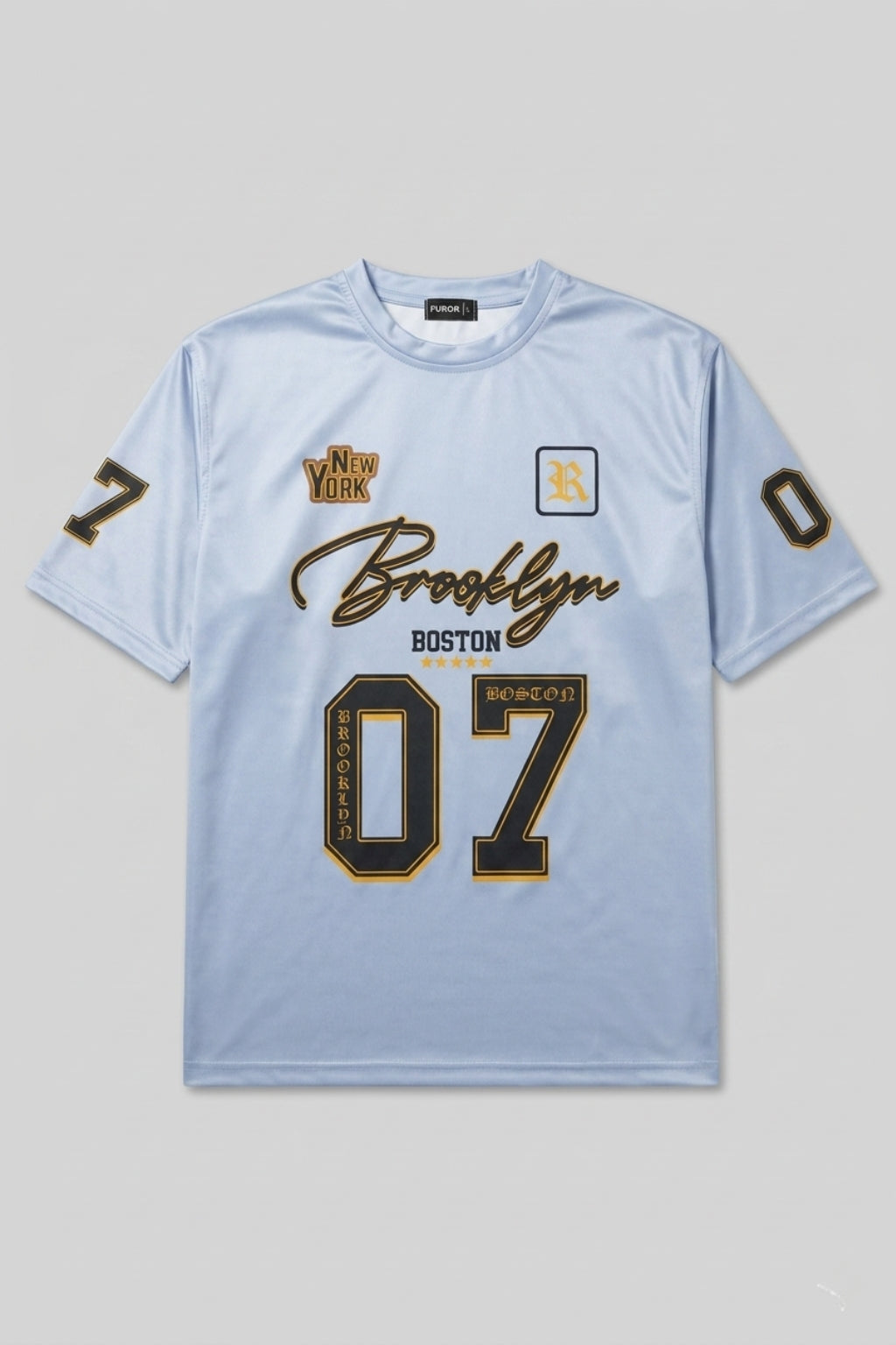 Flat lay product photo of The Coastal Hybrid Jersey in Carolina Blue, oversized drop-shoulder t-shirt.