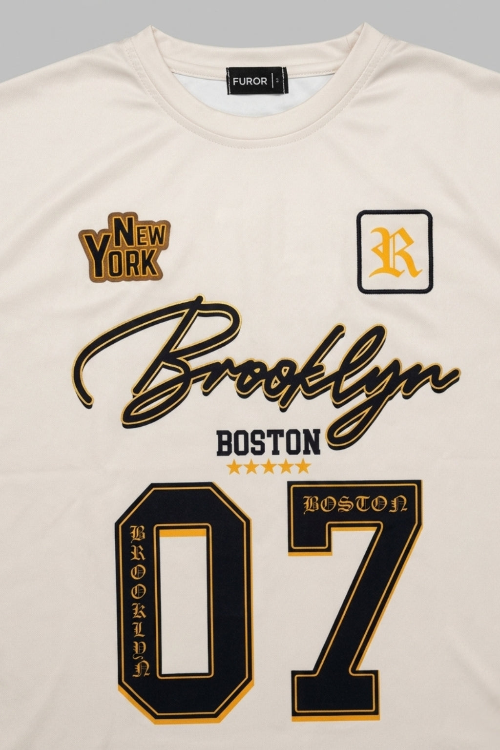 Close-up of Athletic Interlock fabric and high-definition Brooklyn Boston print on Cream jersey.