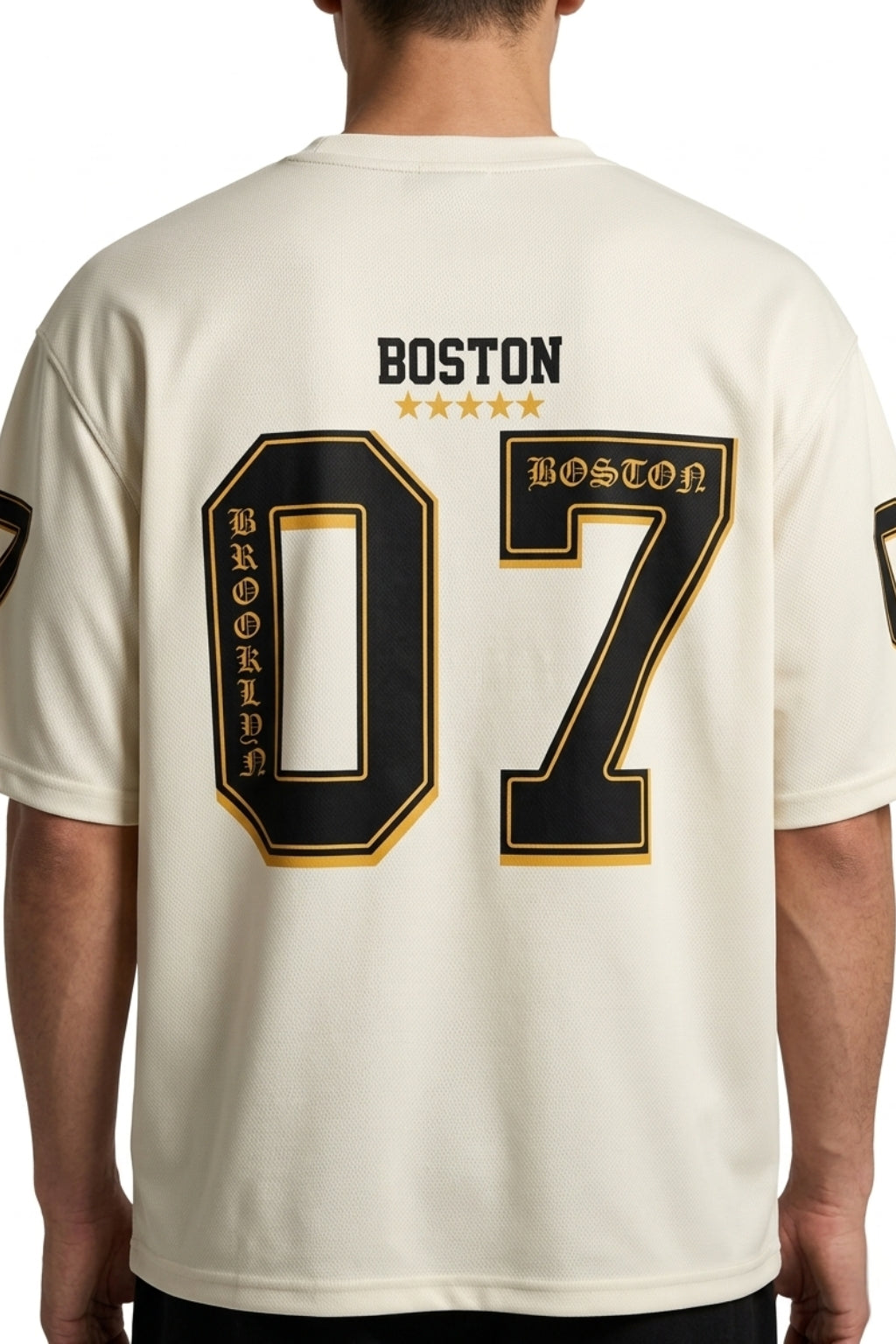 Back view of model showing the drop-shoulder drape and large "07" back print of the Coastal Hybrid Jersey.