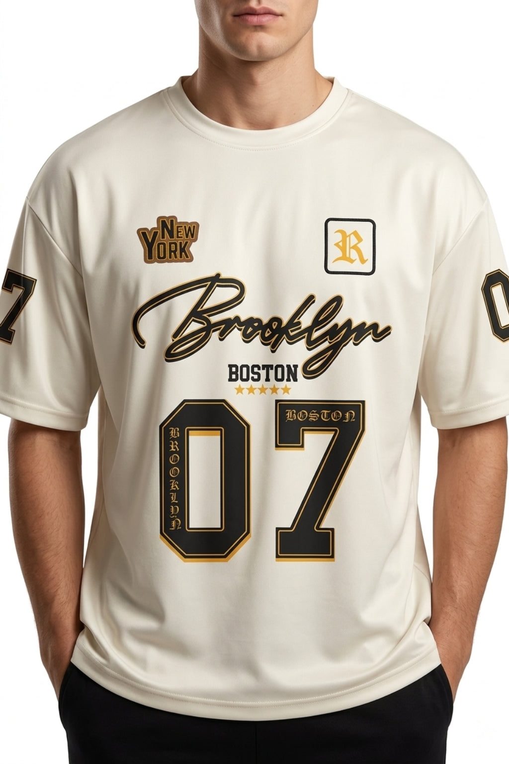 Front view of model wearing The Coastal Hybrid Jersey in Cream showing oversized fit and chest graphics.