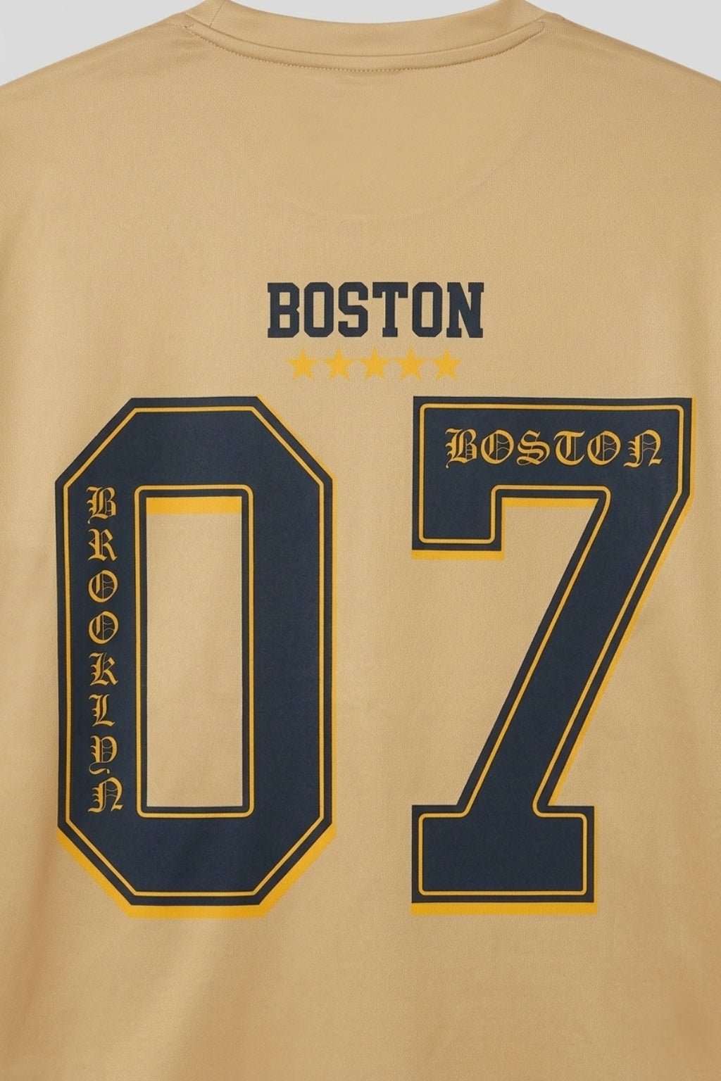 Detail shot of the back graphic and technical interlock fabric texture of the Coastal Hybrid Jersey.