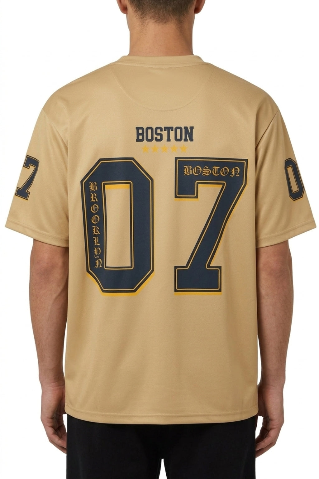 Back view of model showing the drop-shoulder drape and large "07" back print of the Coastal Hybrid Jersey.