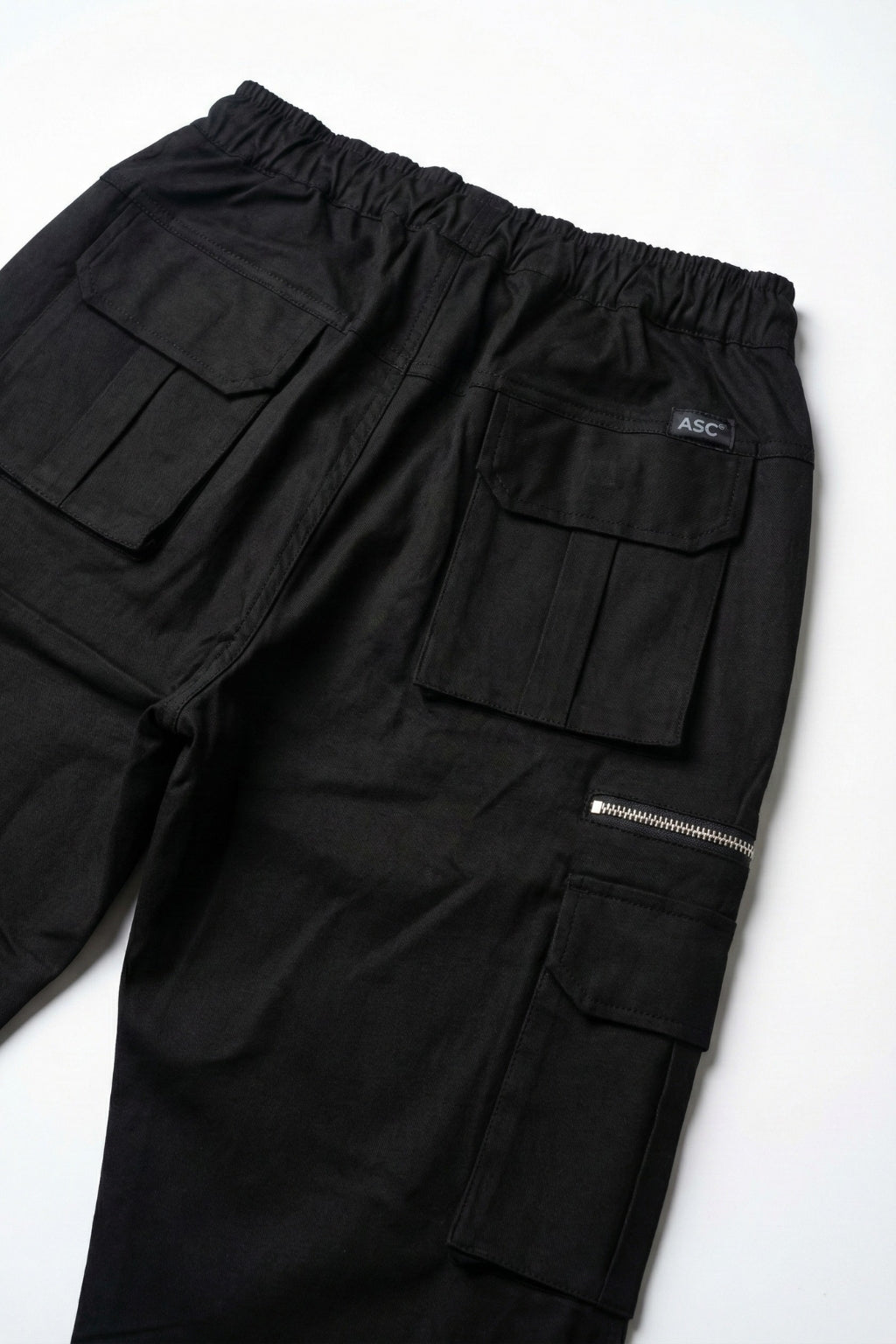 Detailed back view of Eliteez Black utility pants showing premium stitching.