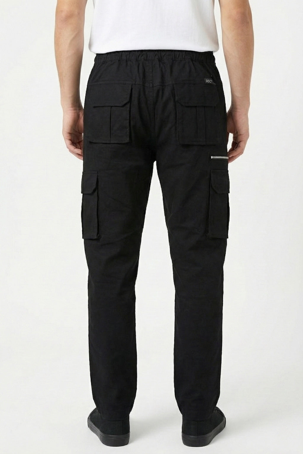Back view on model of Eliteez Black utility cargo pants showing silhouette.