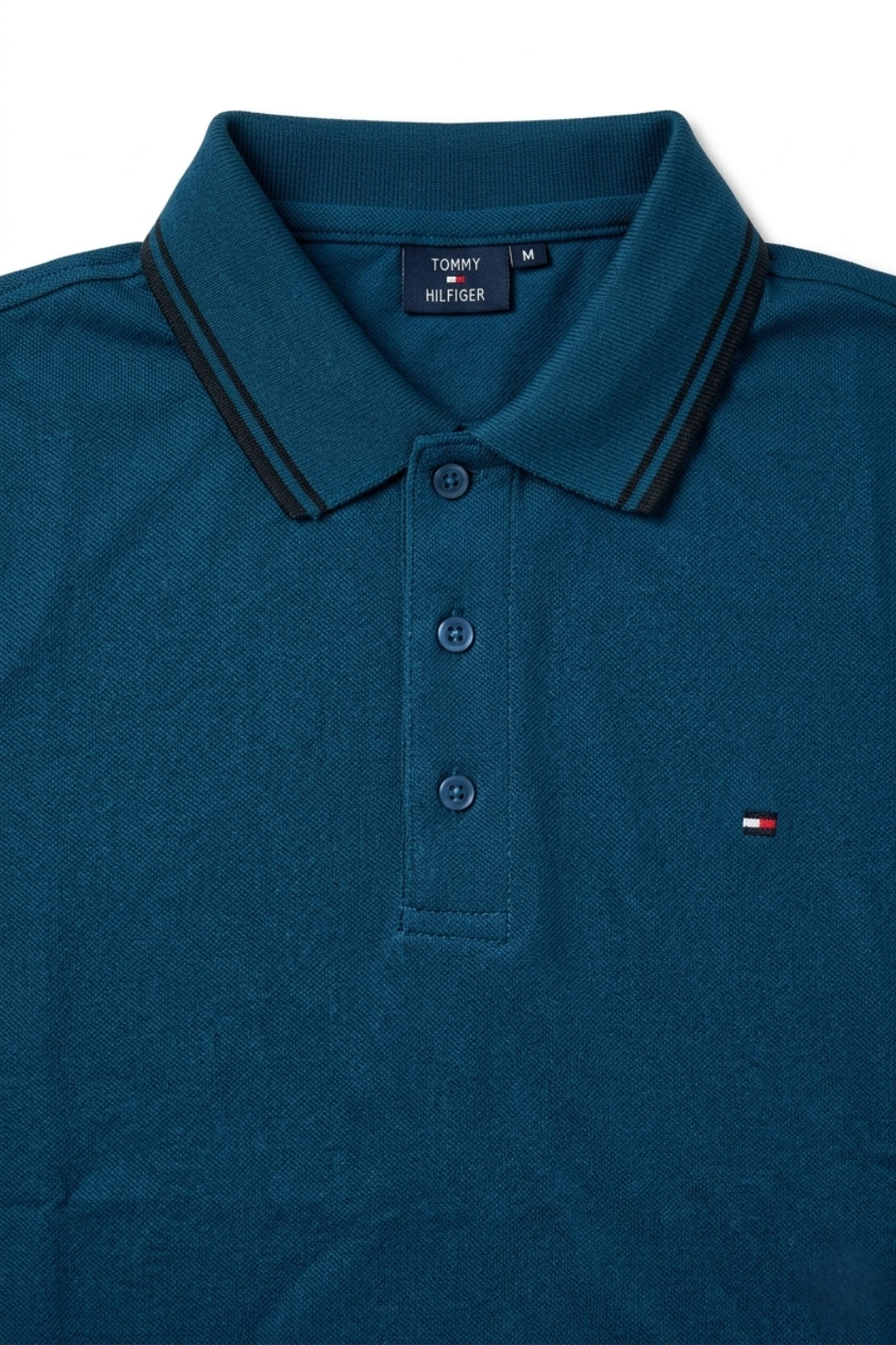 Close-up detail of Eliteez Classic Piqué Polo – Dark Teal premium pique and embroidered logo.
