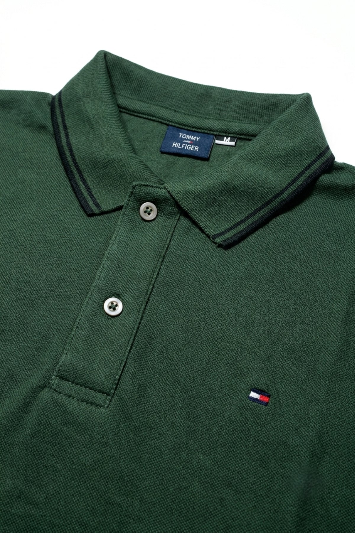Close-up detail of Eliteez Classic Piqué Polo Forest Green premium pique and embroidered logo