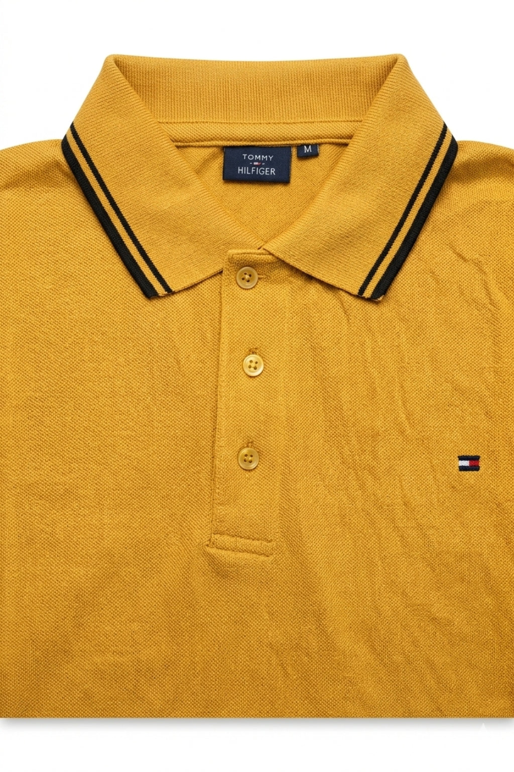 Close-up detail of Eliteez Classic Piqué Polo – Mustard premium pique and embroidered logo.