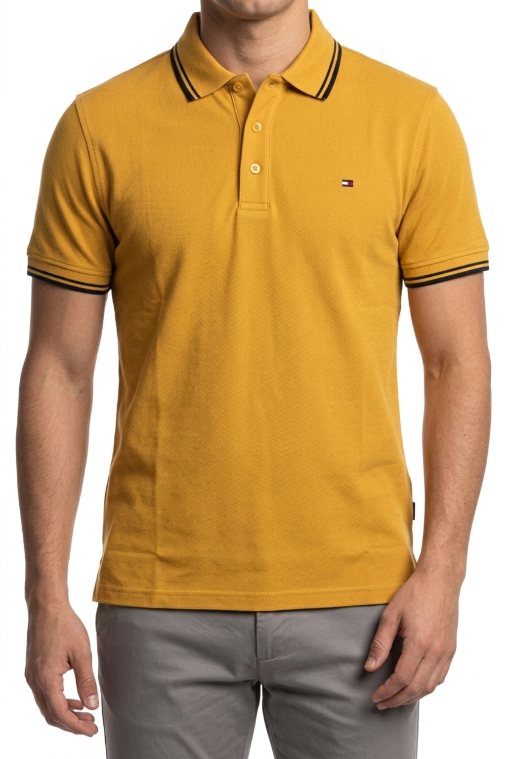 Male model wearing the Eliteez Classic Piqué Polo – Mustard for a smart-casual look.