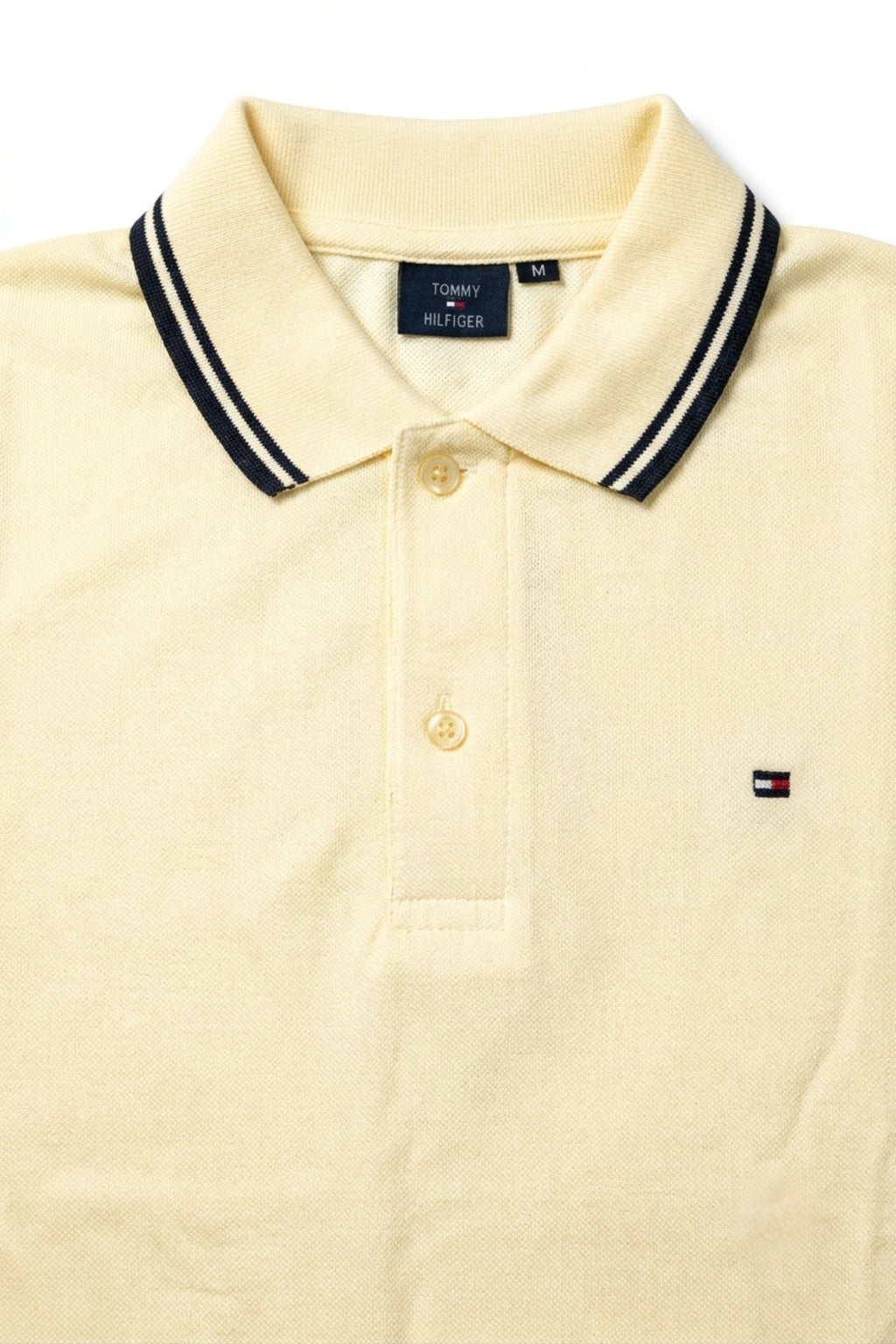 Close-up detail of Eliteez Classic Piqué Polo Pale Lemon premium pique and embroidered logo