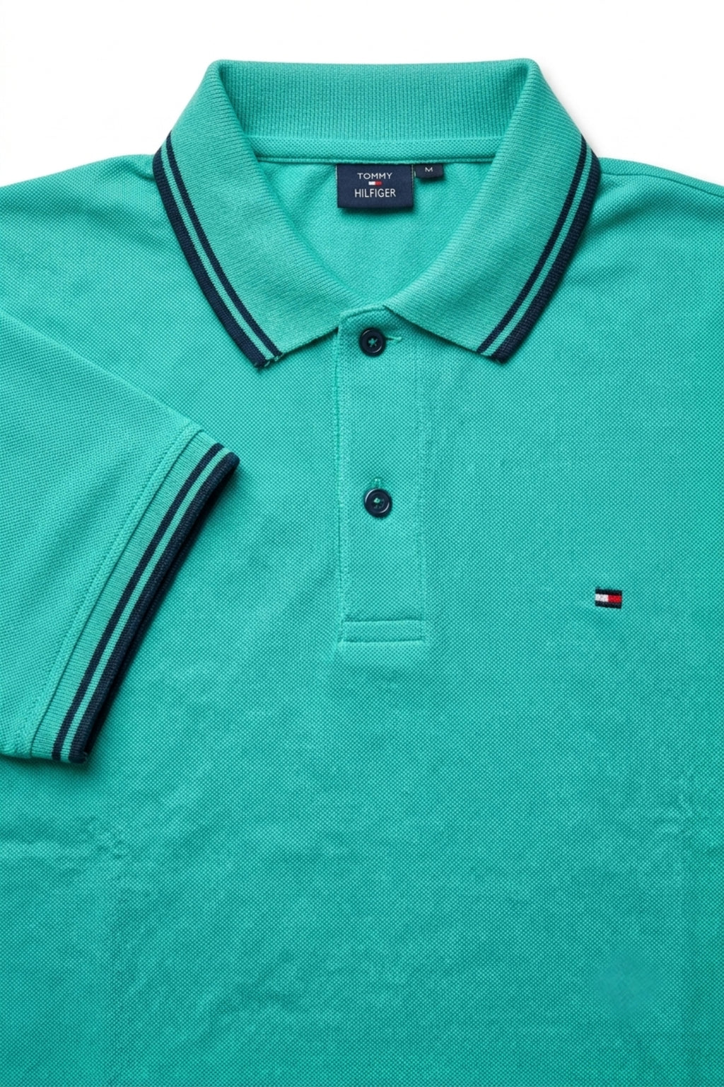 Close-up detail of Eliteez Classic Piqué Polo Turquoise premium pique and embroidered logo