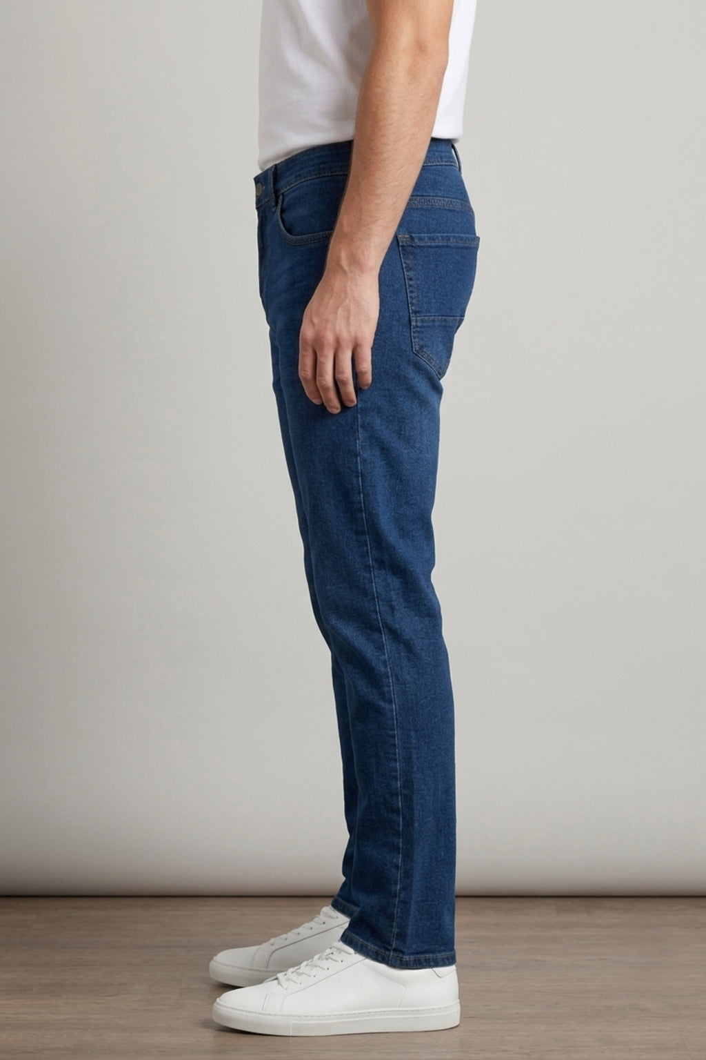 Side view of model wearing Eliteez Classic Prime Dark Blue Denim Jeans