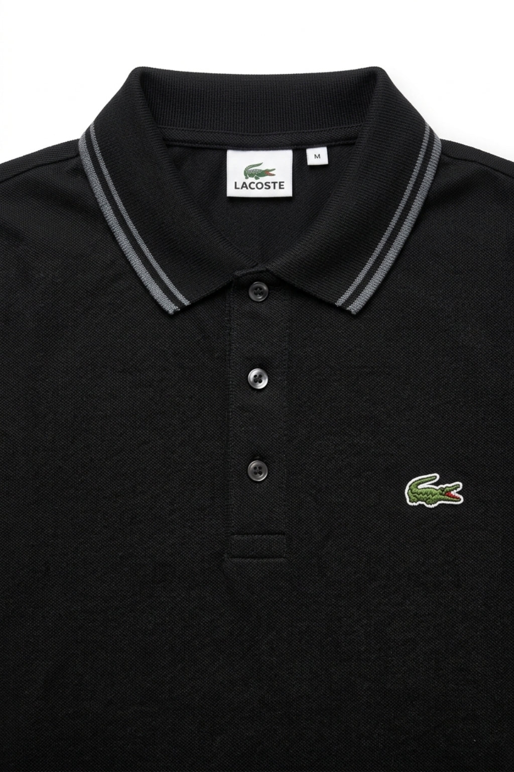 Close-up detail of Eliteez Classic Stripe Collar Polo - Black premium pique and embroidered logo.