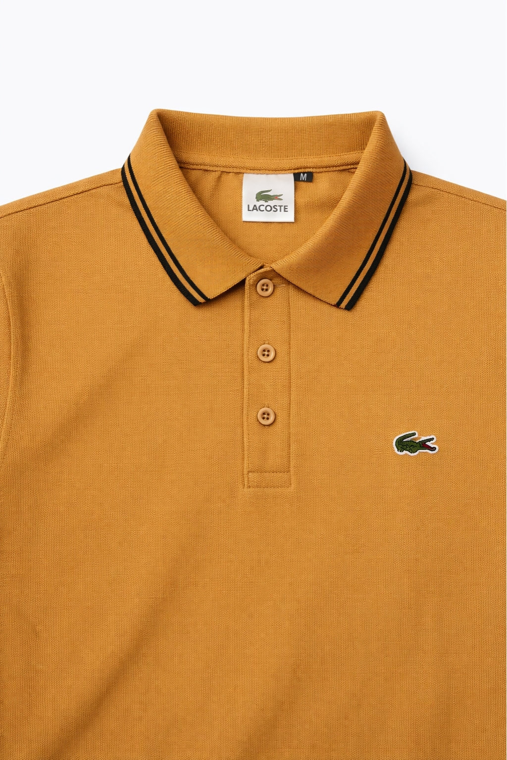 Close-up detail of Eliteez Classic Stripe Collar Polo - Mustard Gold premium pique and embroidered logo.
