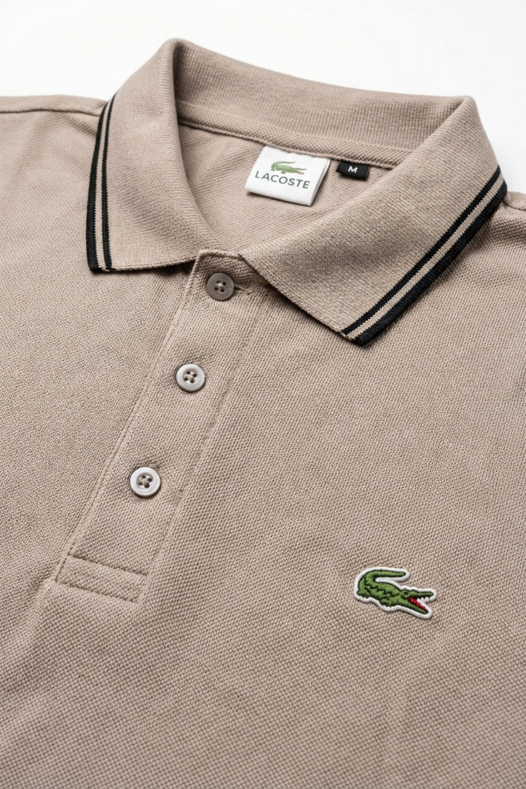 Close-up detail of Eliteez Classic Stripe Collar Polo Taupe premium pique and embroidered logo