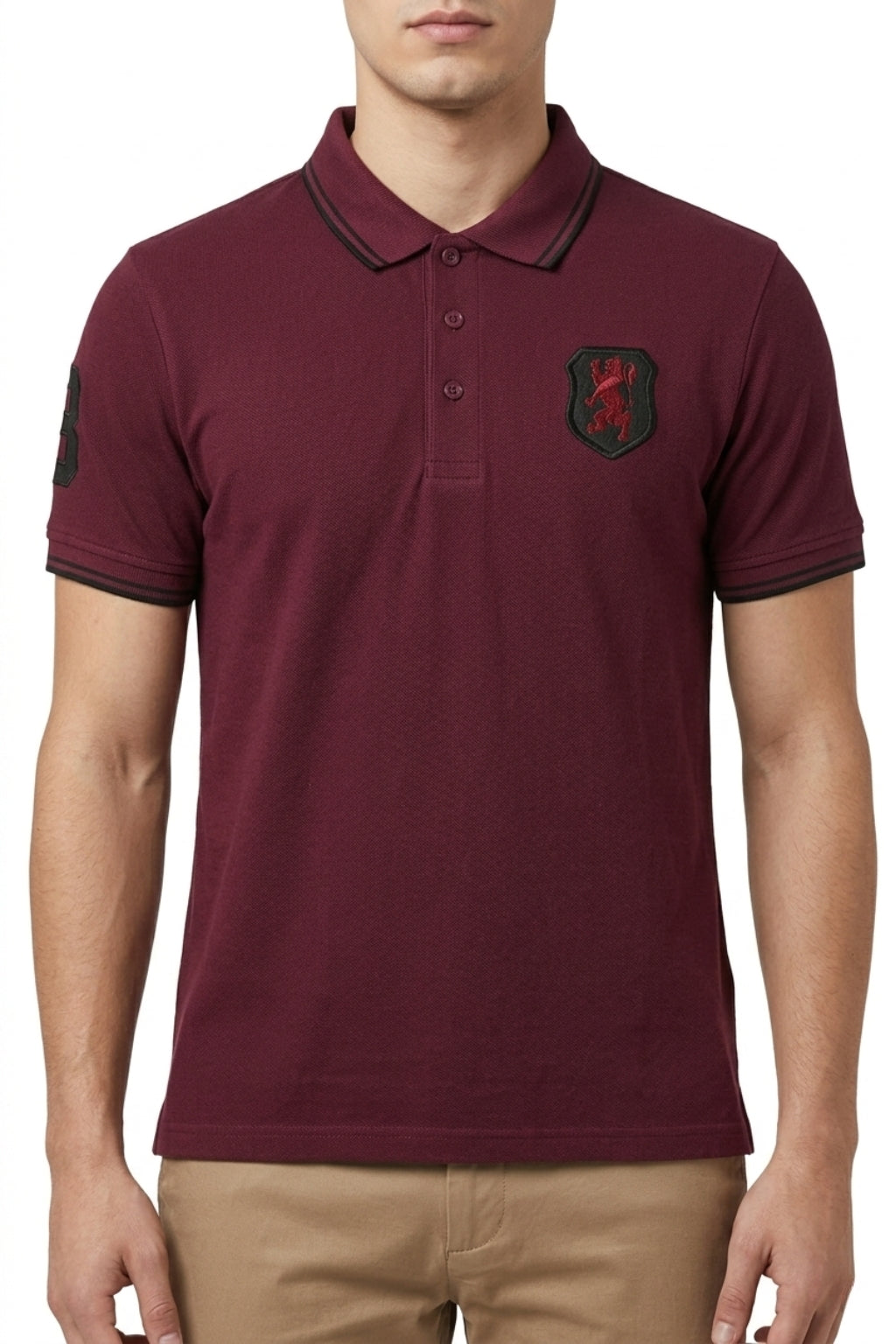 Male model wearing the Eliteez embroidered Lion Pique Polo – Burgundy for a smart-casual look.