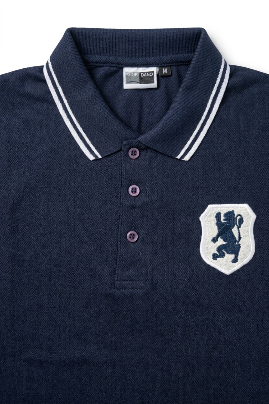Close-up detail of Eliteez embroidered Lion Pique Polo – Navy Blue premium pique and embroidered logo.