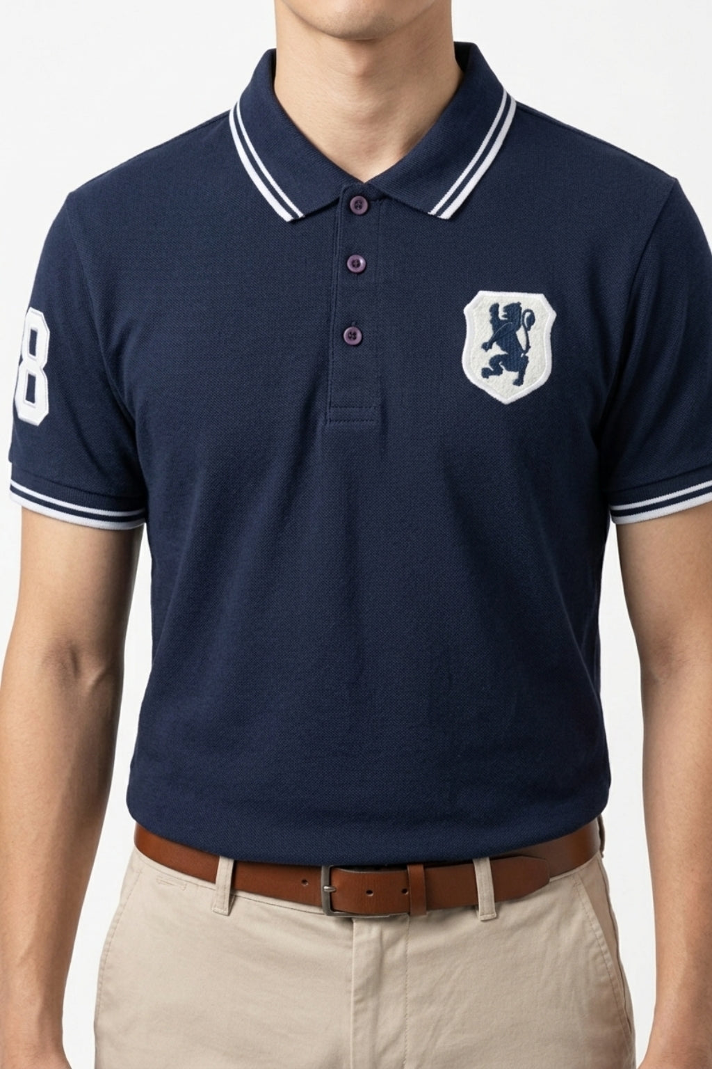 Male model wearing the Eliteez embroidered Lion Pique Polo – Navy Blue for a smart-casual look.