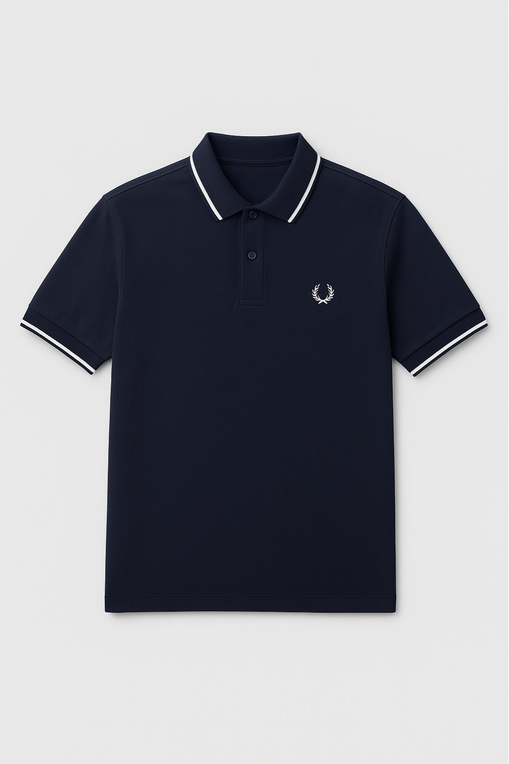 Close-up of laurel embroidery on Eliteez Heritage Polo Navy Blue