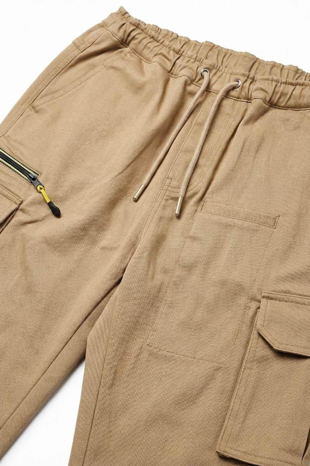 Macro shot of Eliteez Khaki cargo pants showing pocket and fabric texture.