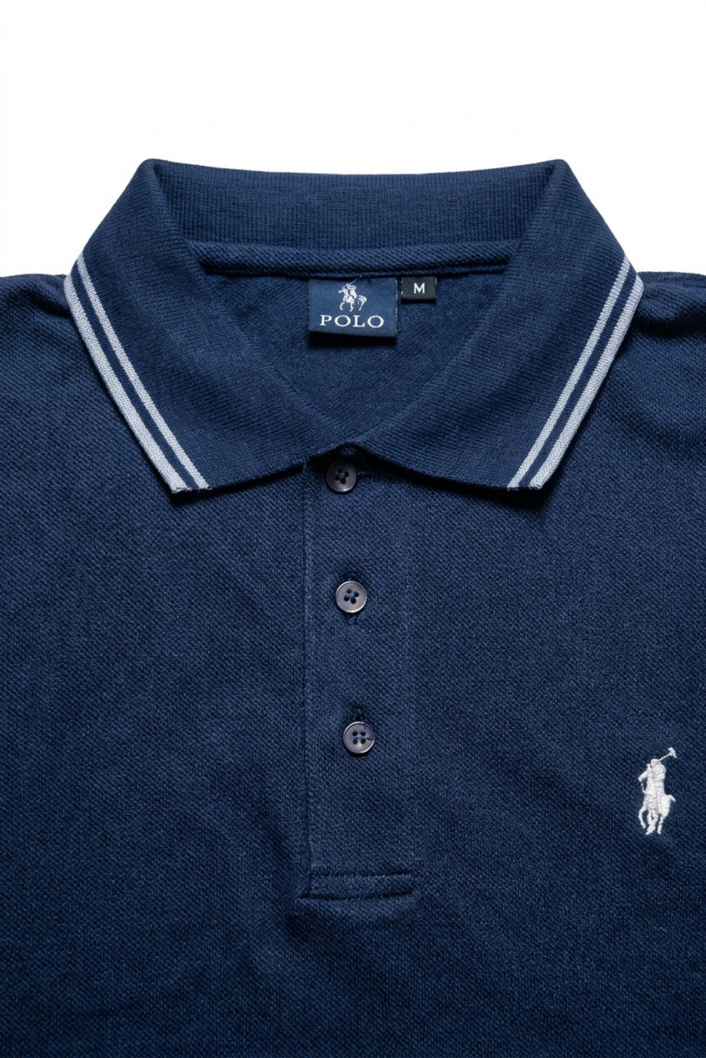 Close-up detail of Eliteez Piqué Polo Rider Navy Blue embroidered logo