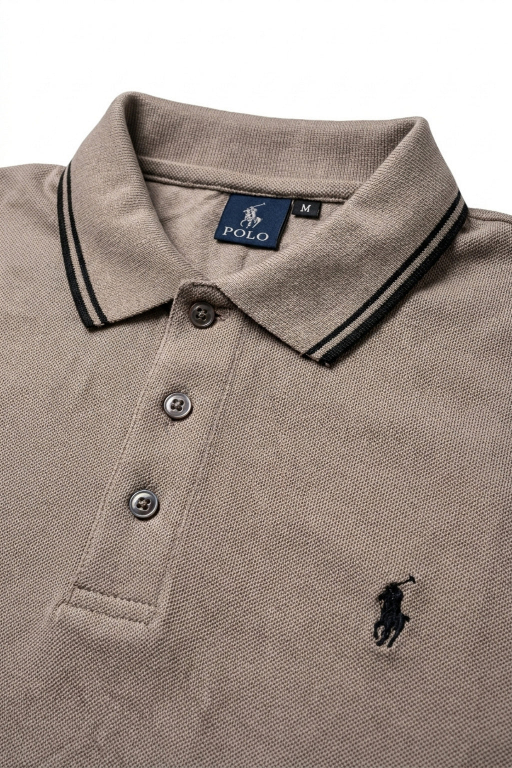 Close-up detail of Eliteez Piqué Polo Rider Taupe embroidered logo