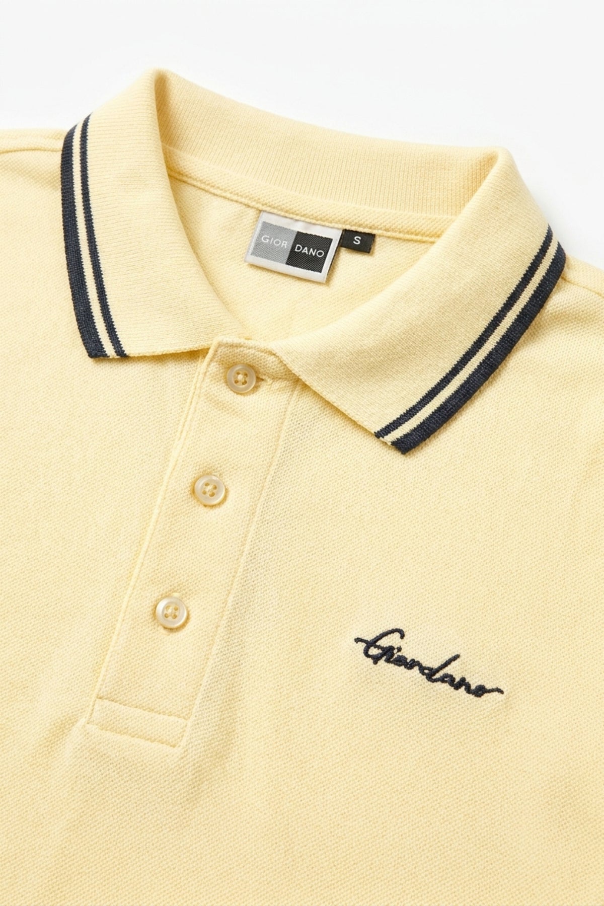 Close-up of twin-tip collar detail on Eliteez Signature Polo Pale Lemon