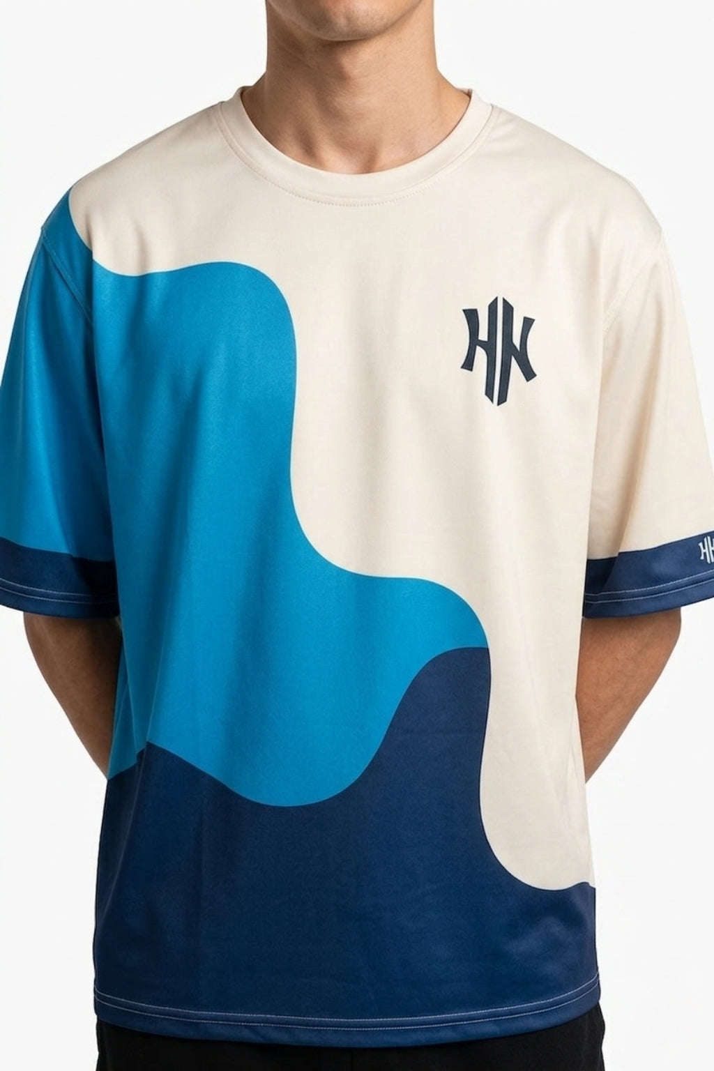 Cropped front view of model wearing Eliteez Strata Wave drop-shoulder tee.