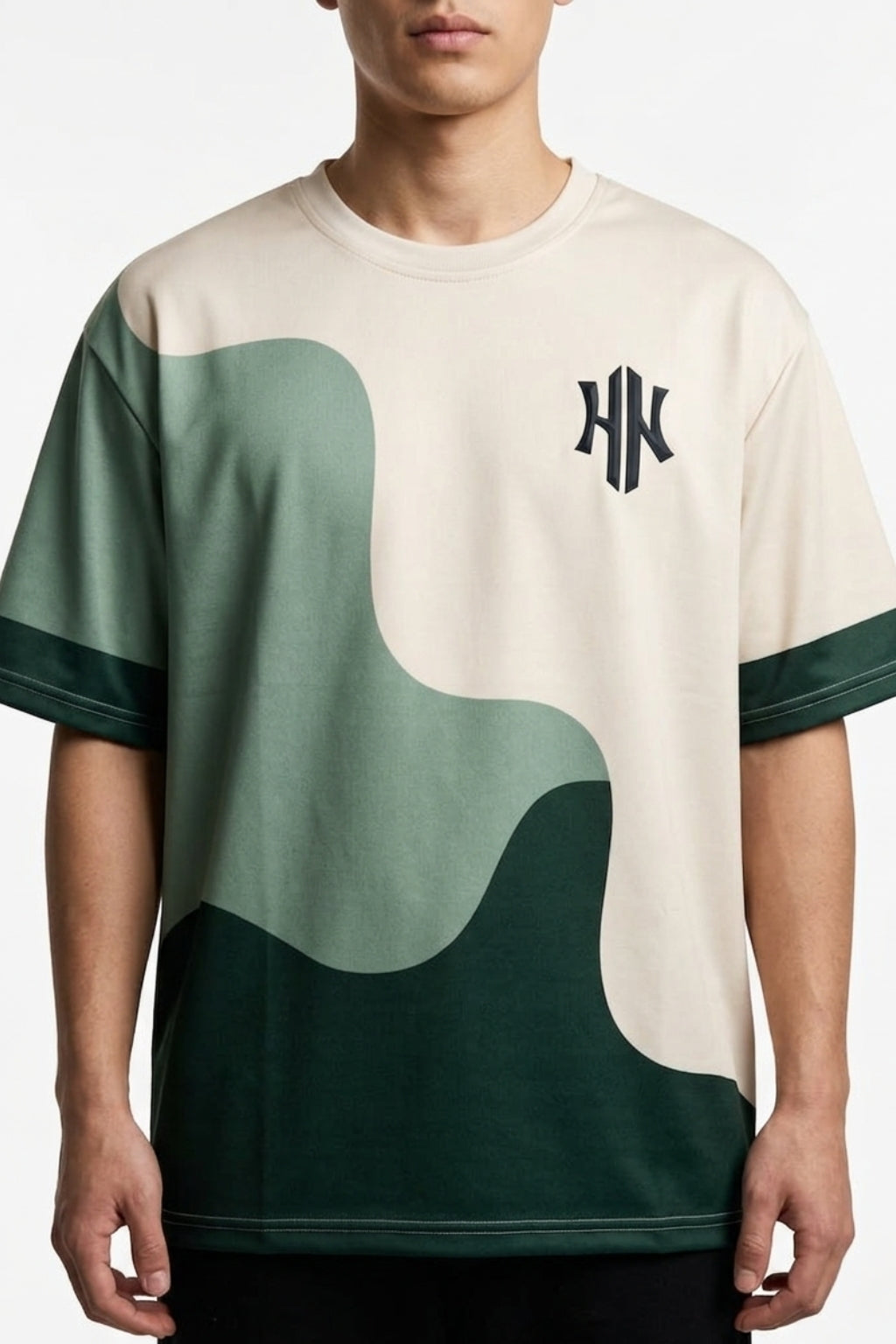 Cropped front view of model wearing Eliteez Strata Wave drop-shoulder tee.