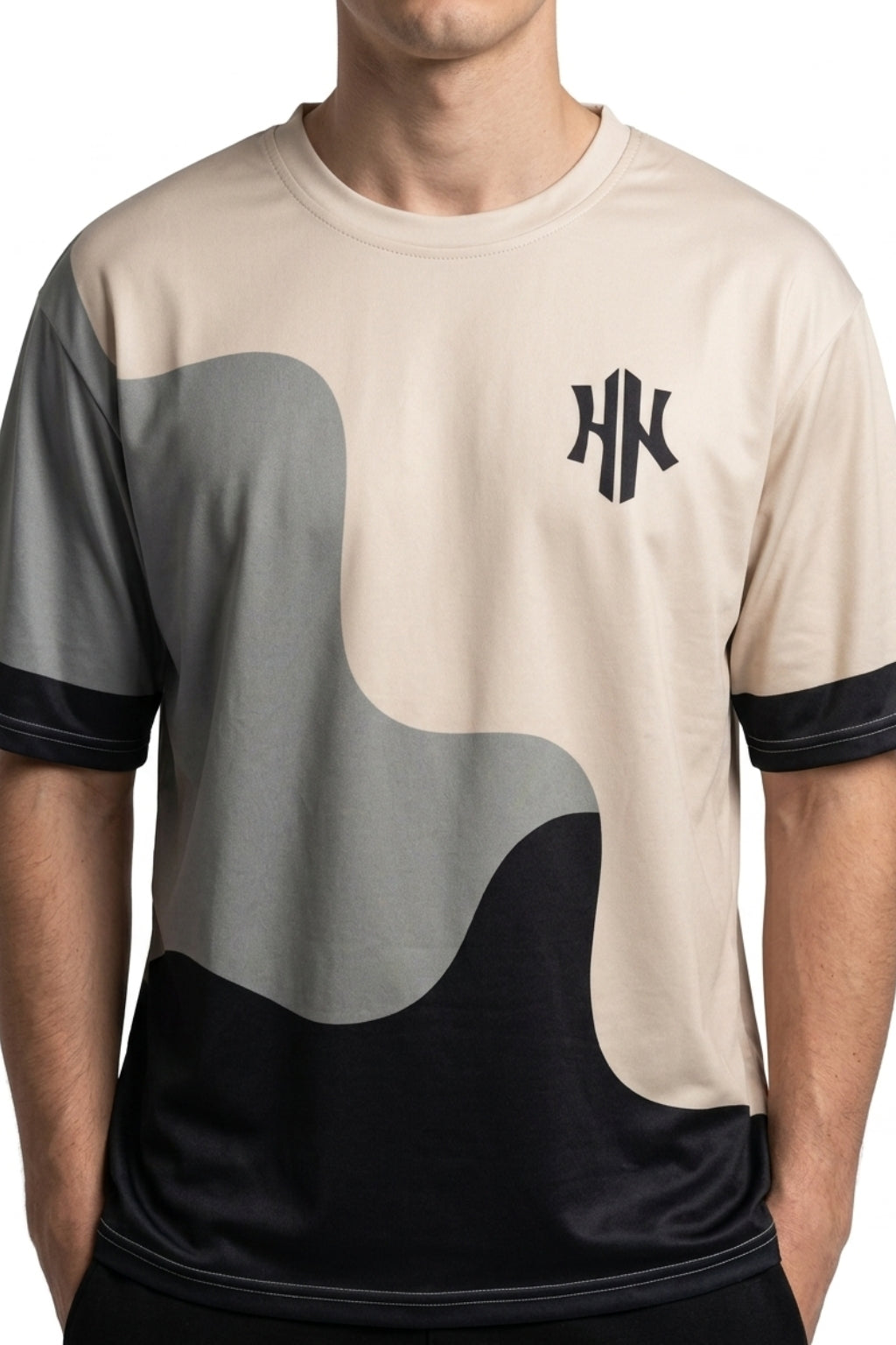 Cropped front view of model wearing Eliteez Strata Wave drop-shoulder tee.